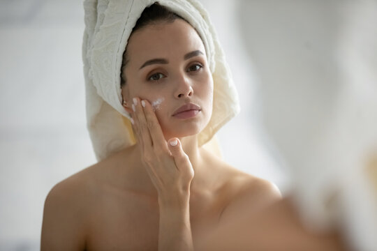 Test For Allergy. Careful Young Woman With Sensitive Skin Applying Small Spot Of Hypoallergenic Delicate Cream Lotion Serum Of Natural Organic Ingredients On Her Chick After Shower To Look At Result