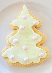 Christmas tree shaped big cookie served on white plate