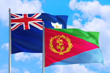 Eritrea and Anguilla national flag waving in the windy deep blue sky. Diplomacy and international relations concept.