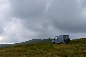 Old SUV in the mountains. Transport. Travels.