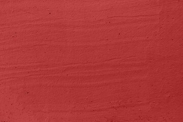 Blood red stucco background texture close up