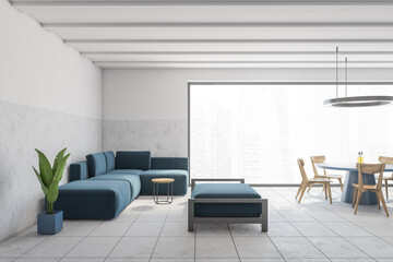White living room interior with blue sofa