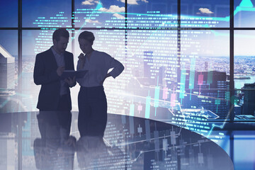 Fototapeta premium Man and woman in panoramic office, financial graph