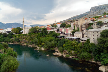 Fototapeta na wymiar Old town of Mostar, Bosnia and Herzegovina, view from Stari Most bridget to Neretva river and old mosques