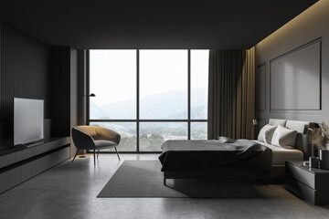 Gray master bedroom with armchair