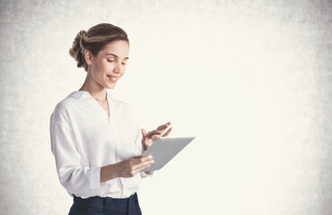 Smiling young woman using tablet, mock up