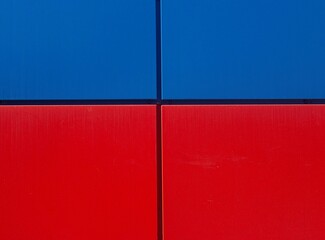 Blue-red facing tiles on the facade of the building