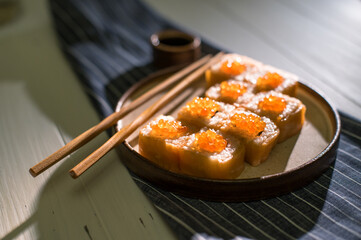 Sushi roll Philadelphia with salmon and caviar