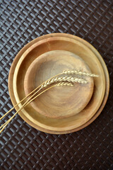 Modern minimalistic wooden dishes or plates. Kitchen decor and cozy home. Eco-friendly tableware and zero plastic concept