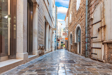 Fototapeta na wymiar Narrow adriatic street in the Old Town Of Budva, Montenegro