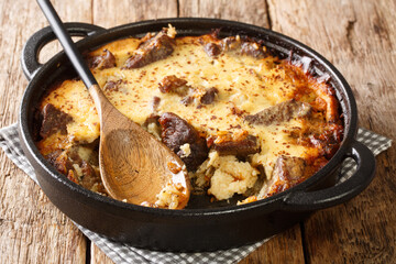 Tave kosi baked lamb and rice with yoghurt close-up in a pan on the table. horizontal