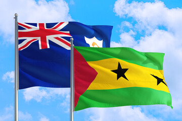 Sao Tome And Principe and Anguilla national flag waving in the windy deep blue sky. Diplomacy and...