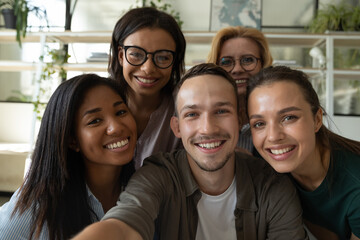 Happy laughing team diverse colleagues posing for selfie portrait in office, friendly group of...
