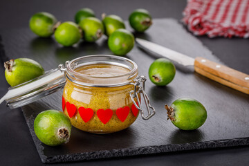 Still life with feijoa fruits and feijoa jam in the jar