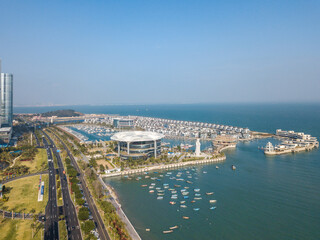Fototapeta premium Aerial view of the Yacht Terminal, Xiamen Xiangshan Yacht Club in Xiamen city. Xiamen city architecture on the coastline in Fujian, China