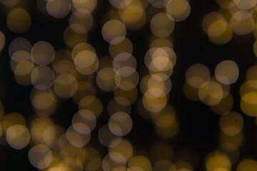 Background of New Year's garlands like stars. Christmas atmosphere with garlands in defocus.