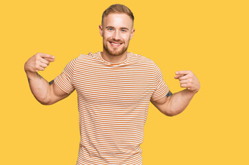Young irish man wearing casual clothes looking confident with smile on face, pointing oneself with...