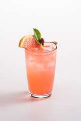 Summer refreshing cocktail with ice. Ginger ale, vodka, grapefruit syrup, lemon juice.