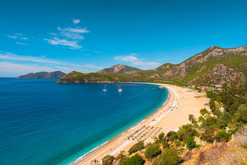 Beautiful sandy beach with yachts in Oludeniz, Blue Lagoon in Turkey. Summer holiday travel destination