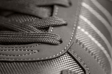fashionable Stylish sneaker close-up texture of sports shoes knotted laces on gumshoes
