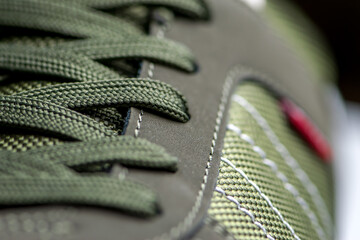 fashionable Stylish sneaker close-up texture of sports shoes knotted laces on gumshoes