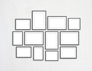 Black frames collection, twelve blank frameworks set on white textured wall, interior decor mock up