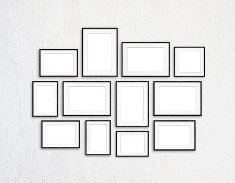 Black frames collection, twelve blank frameworks set on white textured wall, interior decor mock up