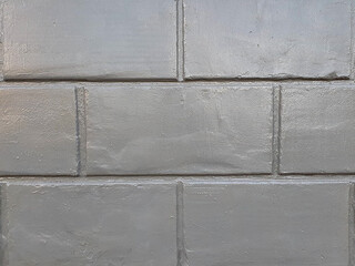 
Concrete wall texture with a relief of gray paint.