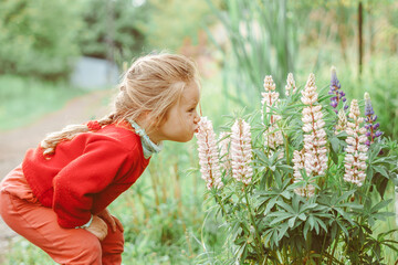a child plays among the grass