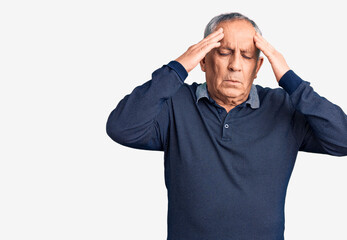 Senior handsome man wearing casual polo with hand on head for pain in head because stress. suffering migraine.