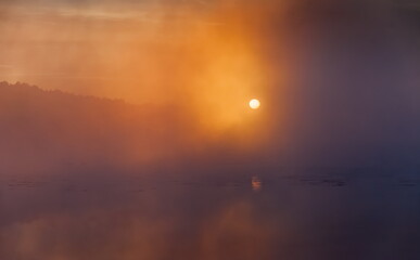 Mist over the lake dawn early morning in the summer