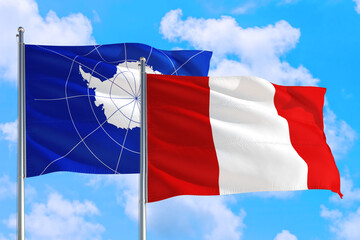Peru and Antarctica national flag waving in the windy deep blue sky. Diplomacy and international relations concept.