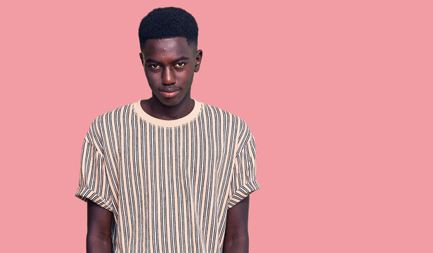 Young african american man wearing casual clothes praying with hands together asking for forgiveness smiling confident.