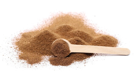 Ground cinnamon powder with wooden spoon isolated on white background