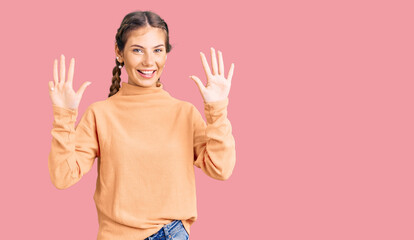 Beautiful caucasian woman with blonde hair wearing casual winter sweater showing and pointing up with fingers number nine while smiling confident and happy.