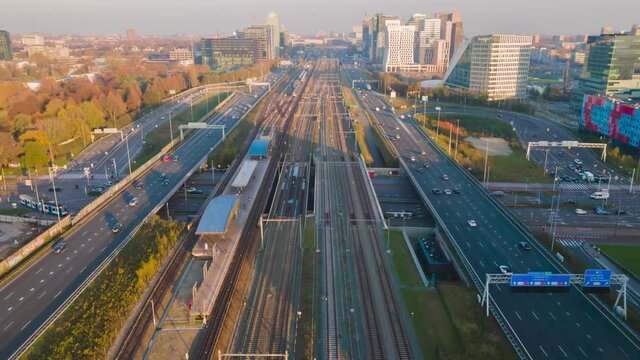 Hyperlapse of Amsterdam highway and railway flying over transportation