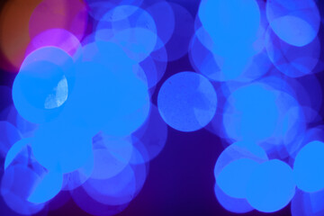 Festive light, bokeh. Blurred light circles. Festive abstract background