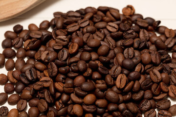 coffee beans, wooden spoon, white background