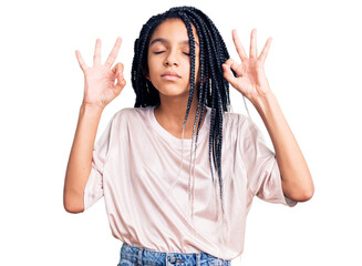 Cute african american girl wearing casual clothes relax and smiling with eyes closed doing meditation gesture with fingers. yoga concept.