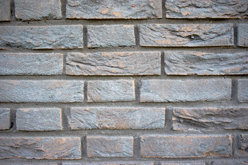 Black decayed stone brick wall background
