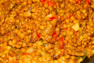 Lentils with vegetables, vegan food, seitan.