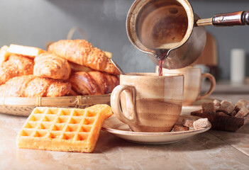 Black coffee and fresh pastries.