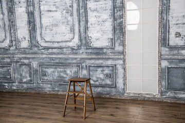 antique candlestick with candles in a large gray hall