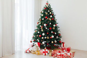 Fototapeta na wymiar New Year's background Christmas tree with gifts interer decor