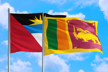 Sri Lanka and Antigua and Barbuda national flag waving in the windy deep blue sky. Diplomacy and international relations concept.