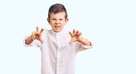Cute blond kid wearing elegant shirt smiling funny doing claw gesture as cat, aggressive and sexy expression
