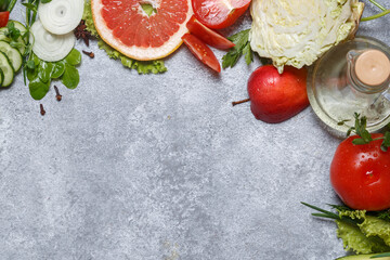 Fresh fruit, vegetable, greens on gray background. Healthy food, clean eating. Detox, dieting