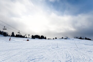 Ski path with slopes in cloudy weather