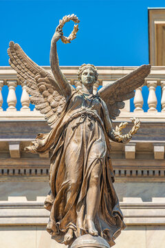 Statue of beautiful angel with wings at sunset colors in Prague historical downtown, Czech Republic, closeup, details.