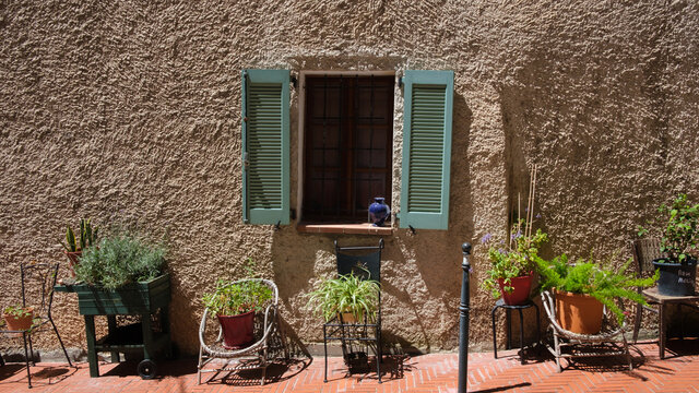 Green roller shutter in a traditional village of the French riviera